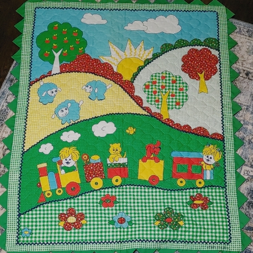 Vintage handmade quilted baby blanket. Colorful train & sheep scene. Green trim.